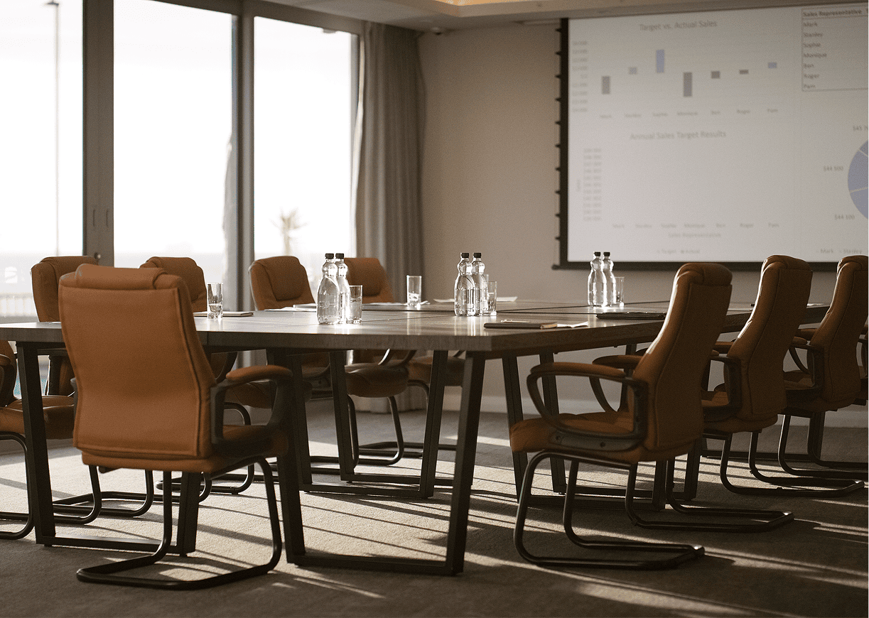 Conference room with table and chairs.