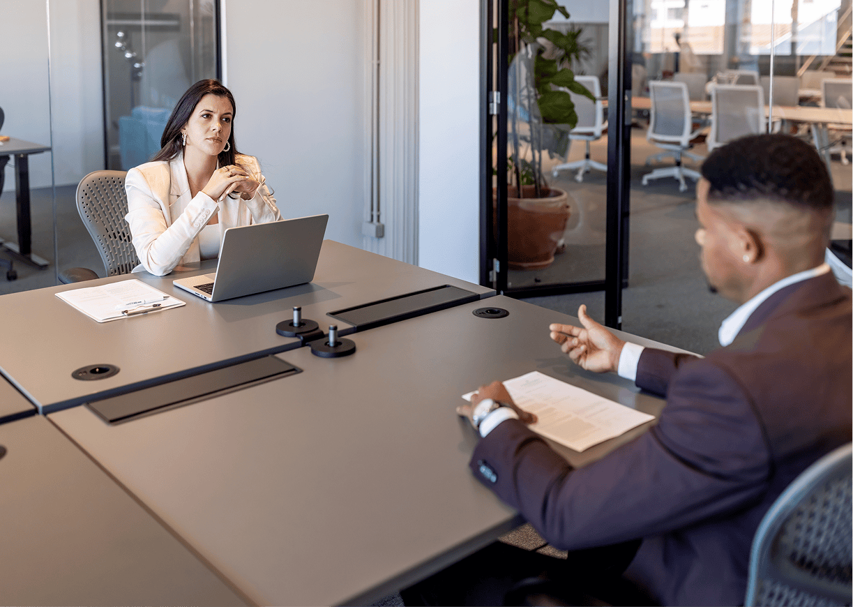 Business meeting with two professionals discussing.