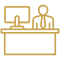 Person sitting at desk with computer.