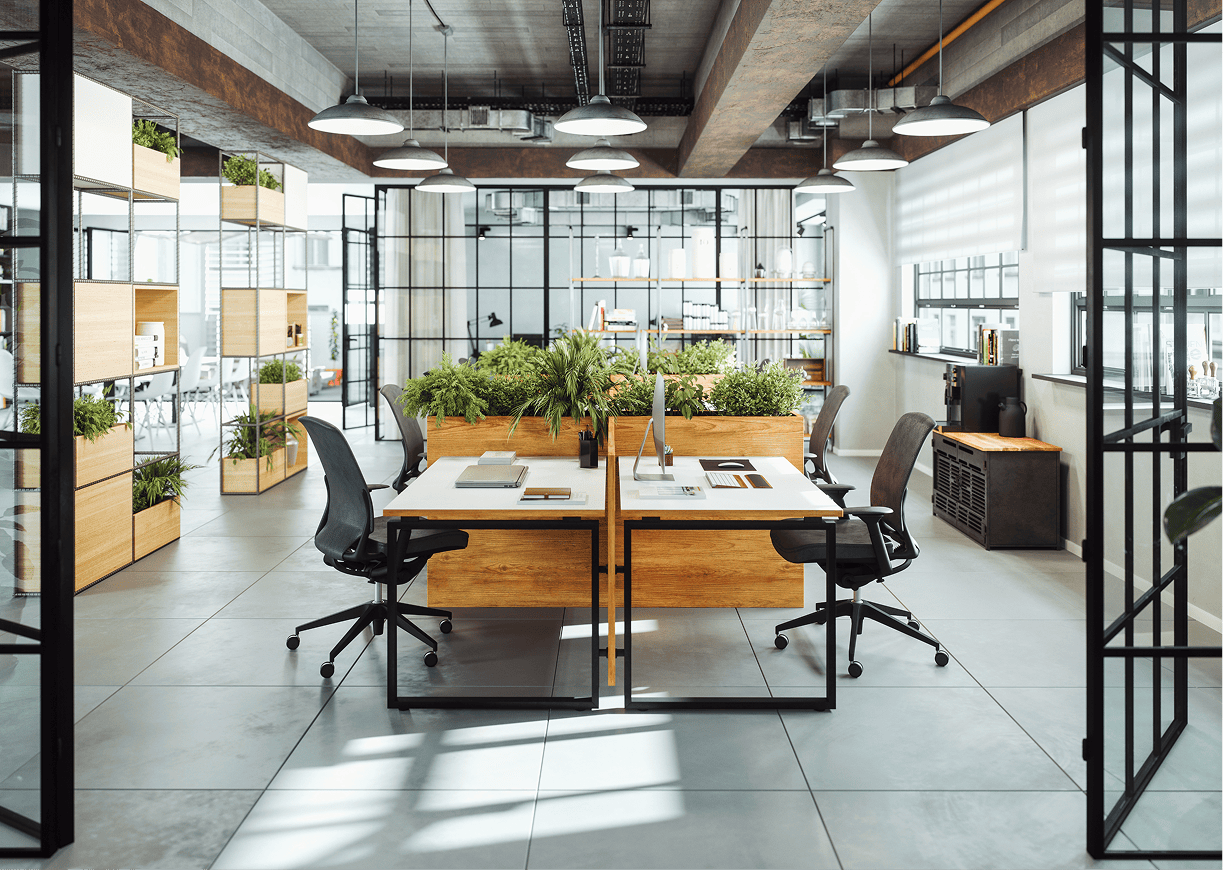 Modern office with desks and indoor plants.