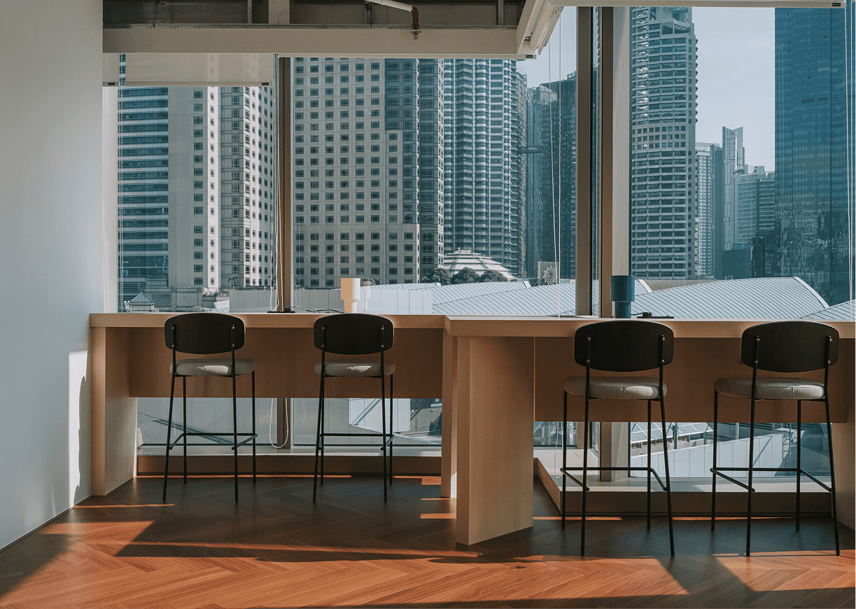 Office space with cityscape view and chairs.