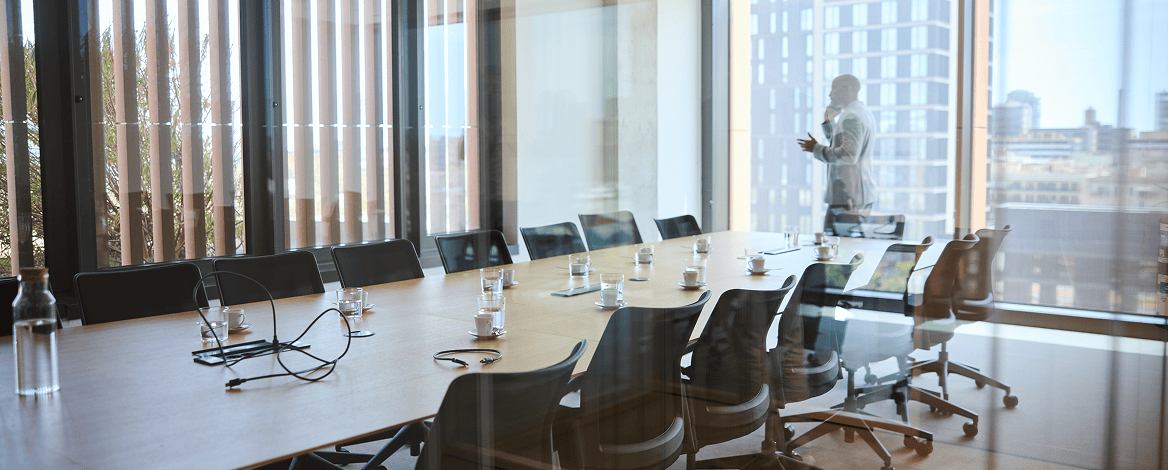 Empty conference room with large table.