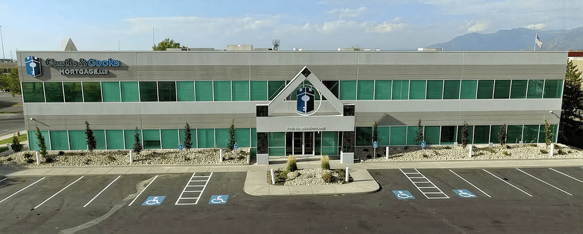 Two-story office building with parking lot.