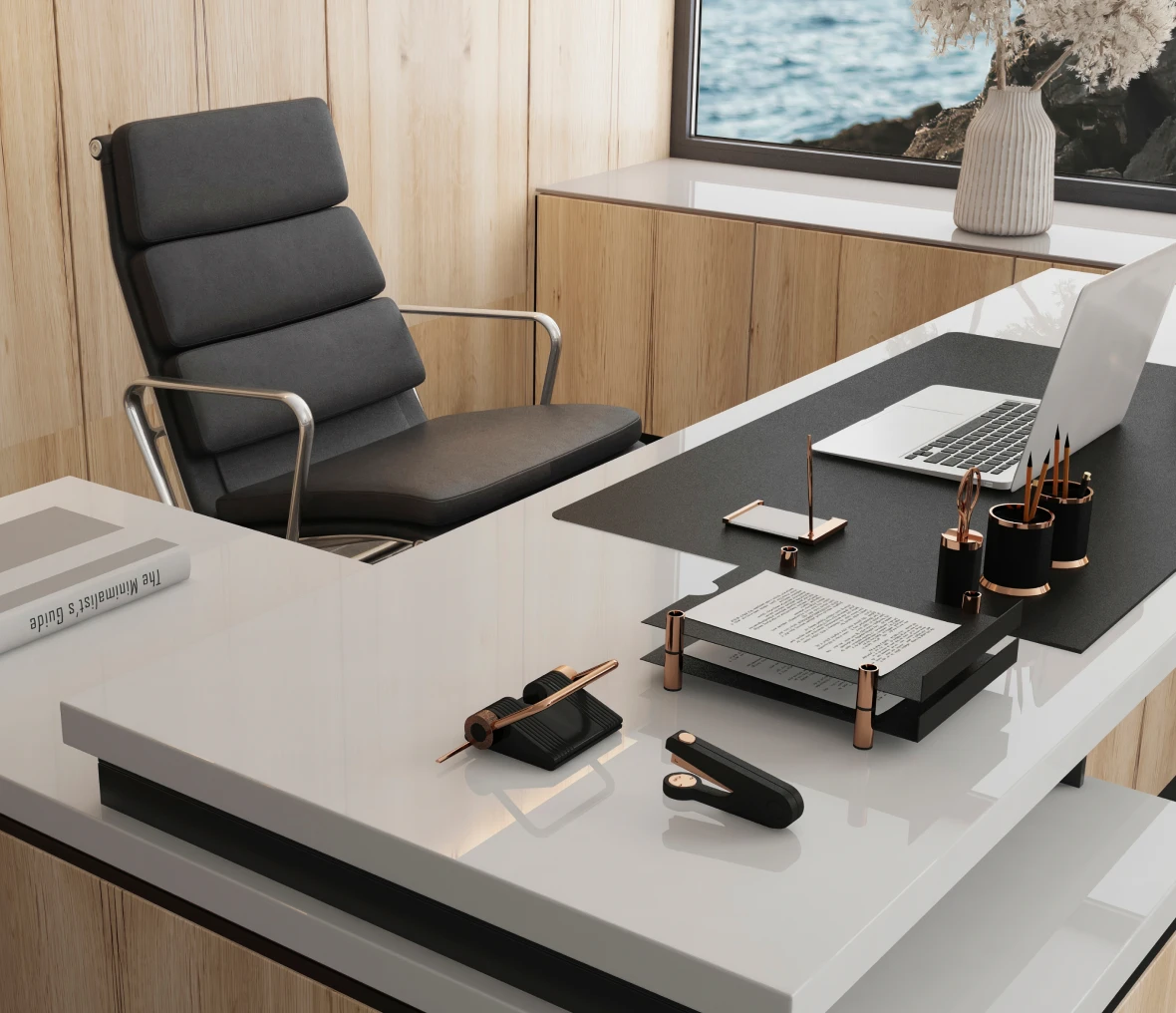 Modern office desk with laptop and chair.