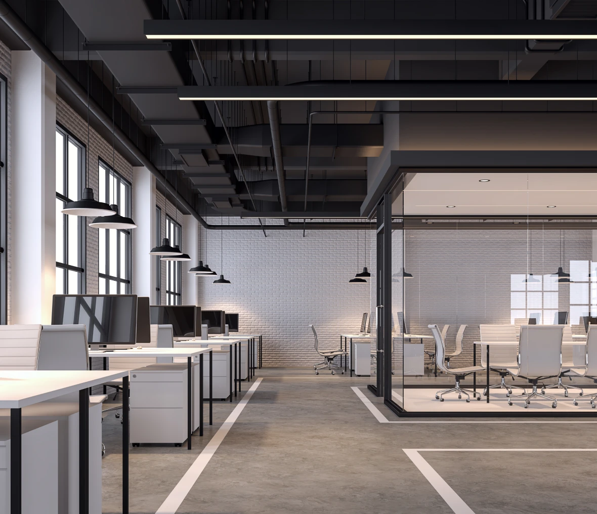 Modern open-plan office with glass meeting room.