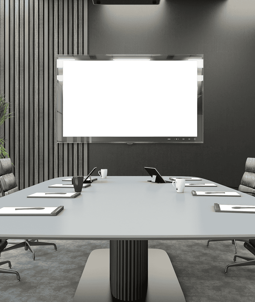 Modern conference room with a large screen.